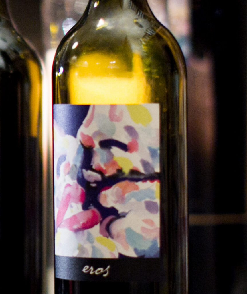 A bottle of Sunstone Eros with its watercolour label
